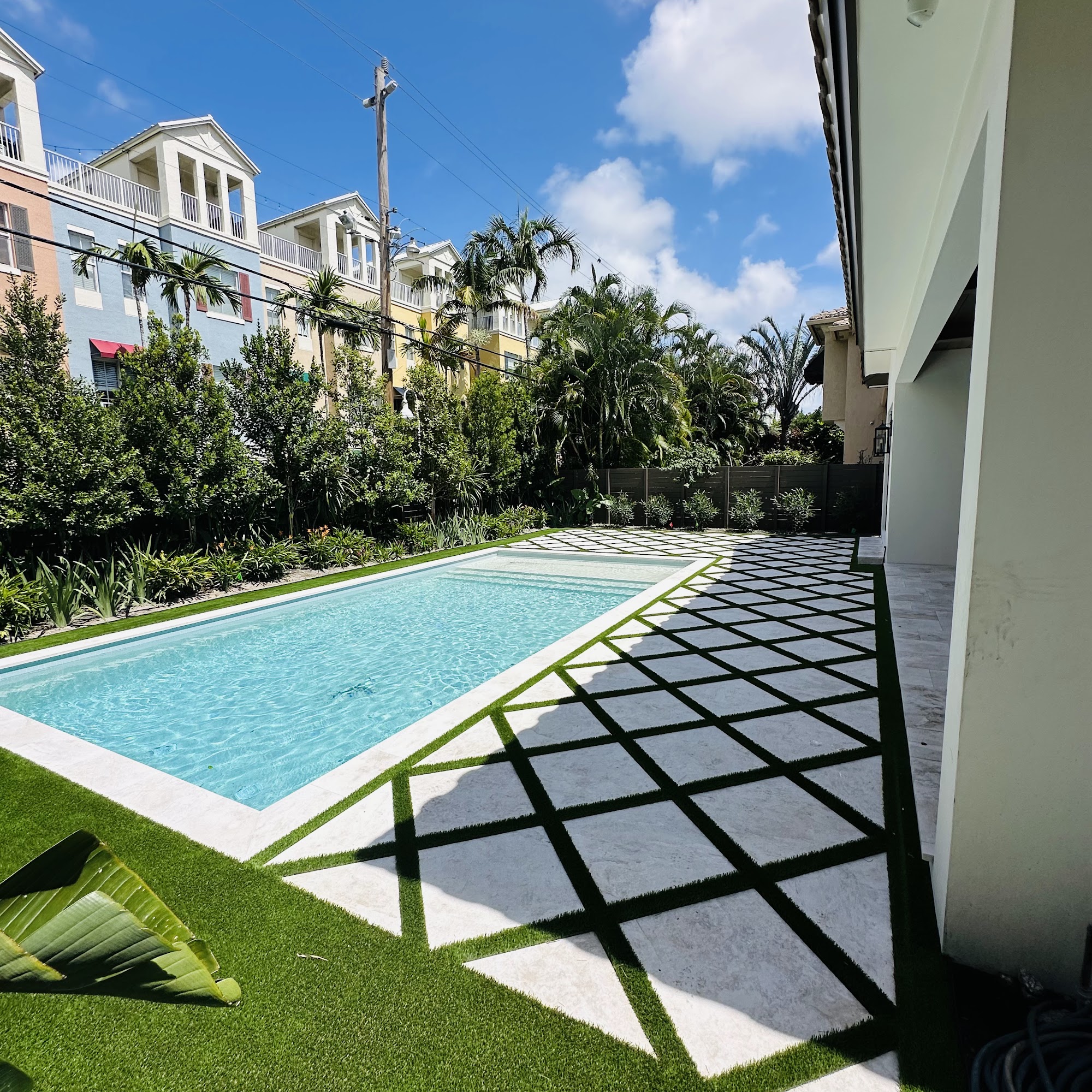 Finished poolside landscape in Pompano Beach